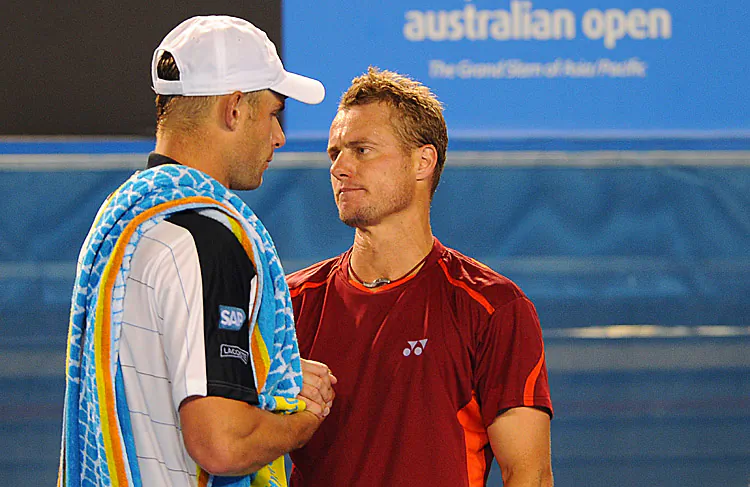Andy Roddick picks himself up off the court after falling during his Australian Open men’s singles match with Lleyton Hewitt. (Nicolas Asfouri/AFP/Getty Images)