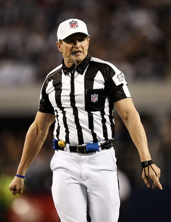 Referee Ed Hochuli will be among the real referees returning to action this weekend. (Ronald Martinez/Getty Images)