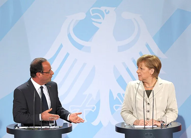 French President François Hollande (L) and German Chancellor Angela Merkel speak to media following talks at the Chancellery about the European debt crisis on May 15, in Berlin, Germany. (Sean Gallup/Getty Images)
