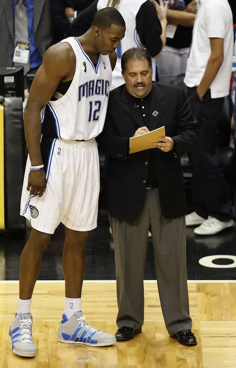 Stan Van Gundy (R) and Dwight Howard (L) led the Magic to the playoffs in all five seasons of their pairing. (Ronald Martinez/Getty Images)