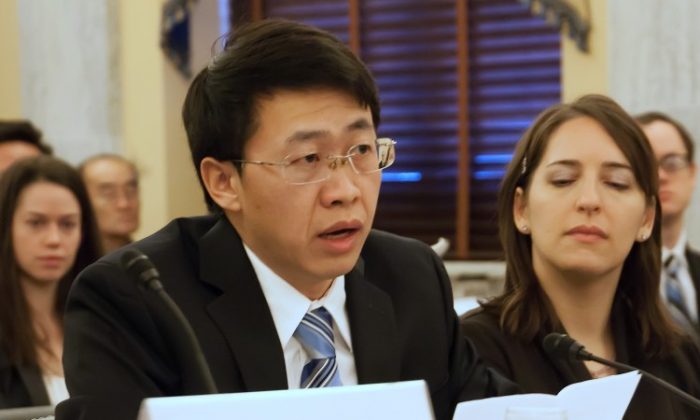 Hu Zhiming, a former officer in the Chinese Air Force, gives testimony to congressional Representatives on Dec. 18. Hu lost everything and spent over eight years in prison because of the Chinese Communist Party's persecution of Falun Gong and Hu's refusal to renounce his faith. (Lisa Fan/The Epoch Times)