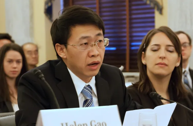 Hu Zhiming, a former officer in the Chinese Air Force, gives testimony to congressional Representatives on Dec. 18. Hu lost everything and spent over eight years in prison because of the Chinese Communist Party's persecution of Falun Gong and Hu's refusal to renounce his faith. (Lisa Fan/The Epoch Times)
