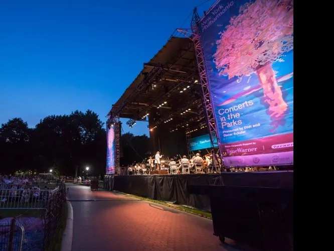 Thousands gather on Monday evening to hear the New York Philharmonic perform for free at the Great Lawn on Central Park. (Amelia Pang/The Epoch Times)