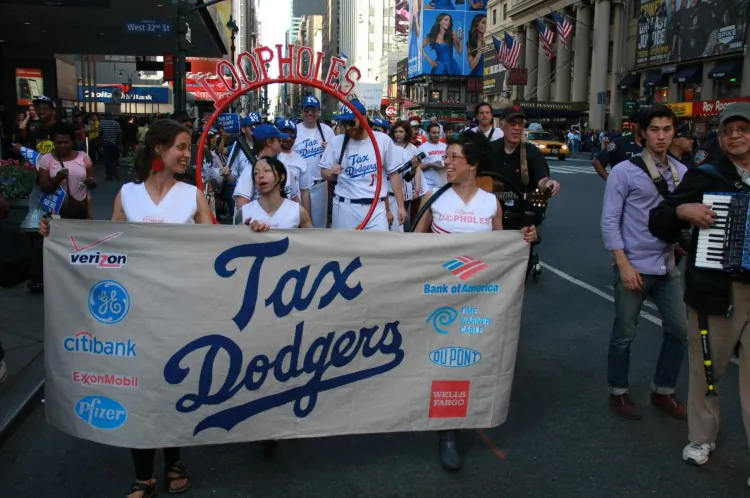 Protesters acting as the fake baseball team 'The Tax Dodgers' march on 7th Avenue on April 17, demonstrating against tax injustice. (Christian Watjen/The Epoch Times)