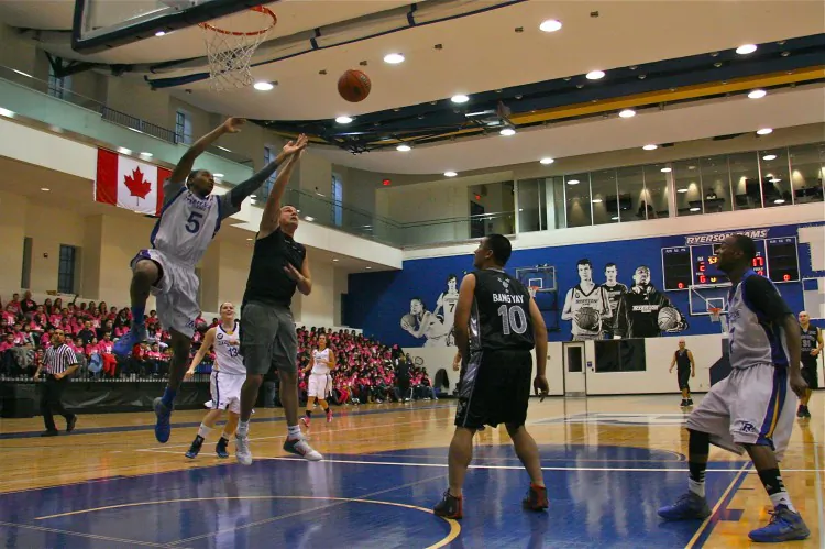 The Ryerson Rams men’s and women’s basketball team plays the Asia Pacific Consultative Committee Police Basketball Team at the annual Team Up Against Bullying event at the Ryerson Mattamy Athletic Centre Nov. 14. The event is a joint collaboration between the Ryerson Rising Rams program and the Toronto Police Service that aims to raise awareness about bullying. (Kristina Skorbach/The Epoch Times)