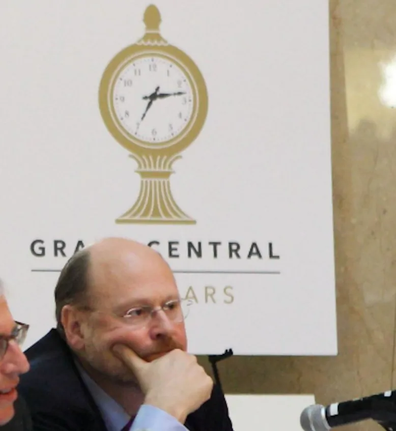 MTA head Joe Lhota sits under the new Grand Central Terminal logo unveiled Tuesday, designed by Pentagram. (Gary Du/The Epoch Times)