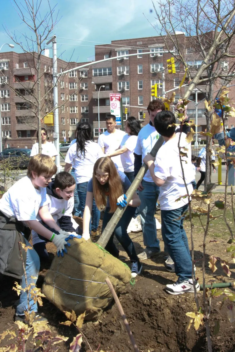 A group of volunteers in Forest Hills, Queens, help out at New York Restoration Project and JetBlue Airways' fourth annual One Thing That's Green event in April, 2011. (Tara MacIsaac/The Epoch Times)