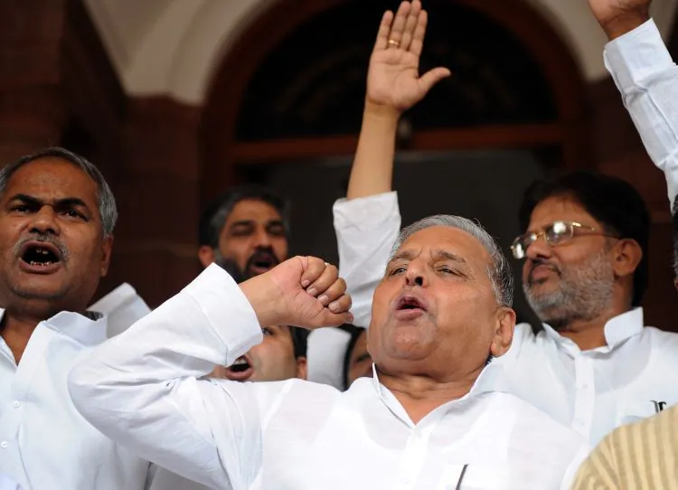 Samajwadi Party (SP) Chief Mulayam Singh (R) and Members of Parliament shout slogans outside parliament in New Delhi on July 29, 2010. The SP recently won a clear majority in elections in the state of Uttar Pradesh according to the Times of India. (PrakashSingh/AFP/Getty Images)