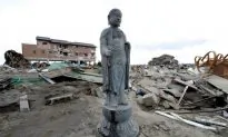 Buddha Statues Stand Amid Rubble After Tsunamis