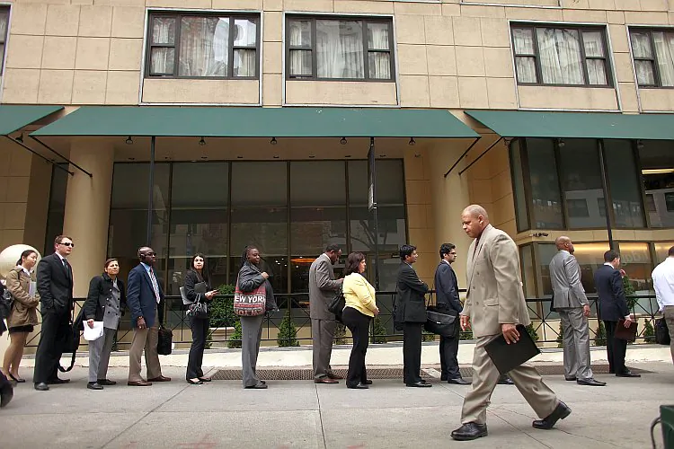 Job seekers line up to attend a job fair in New York City on April 18. The federal government is accepting applications from states for enrollment into a pilot program that will provide short-term employment and training for those receiving unemployment benefits. (Spencer Platt/Getty Images)