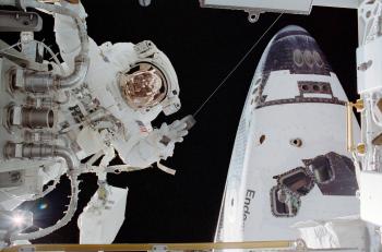 Astronaut John B. Herrington, STS-113 mission specialist, participates in the mission's third and final scheduled spacewalk to perform work on the International Space Station on Flight Day 8, Nov. 30, 2002. The forward section of the Space Shuttle Endeavour is seen on the right. (NASA) Astronaut John B. Herrington, STS-113 mission specialist, participates in the mission's third and final scheduled spacewalk to perform work on the International Space Station on Flight Day 8, Nov. 30, 2002. The forward section of the Space Shuttle Endeavour is seen on the right. (NASA)