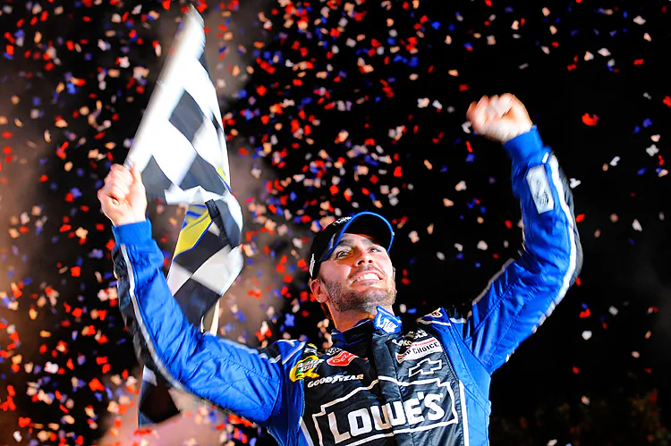 Jimmie Johnson, driver of the 48 Lowe's Chevrolet, celebrates in Victory Lane after winning the NASCAR Sprint Cup Series AAA Texas 500 at Texas Motor Speedway. (Tom Pennington/Getty Images)