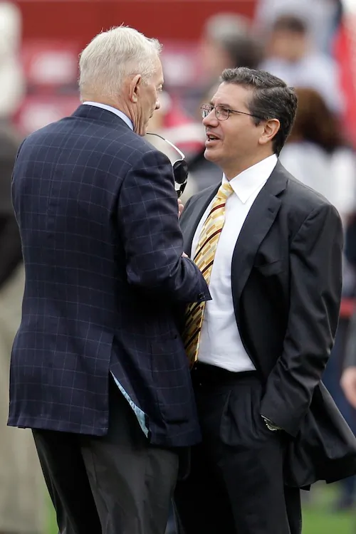 Jerry Jones’s (L) club and Daniel Snyder’s (R) team will be limited to a smaller salary cap the next two years. (Rob Carr/Getty Images)