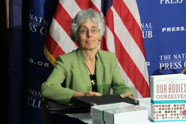 Judy Norsigian, executive director and founder of the women’s health education organization Our Bodies, Ourselves, at the National Press Center on Monday, Oct. 22. Norsigian is overseeing a campaign to distribute the book “Our Bodies, Ourselves” to every member of Congress. (Shar Adams/The Epoch Times)