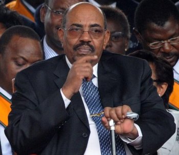DISPUTED VISITOR: Sudanese President Omar Hassan al-Bashir gestures during the promulgation ceremony of Kenya's new constitution at Uhuru Park Aug. 27 in Nairobi. Kenya's prime minister Sunday, condemned his county's failure to arrest Bashir, who is wanted on charges of genocide by the International Criminal Court. (Simon Maina/Getty Images)