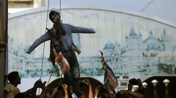 Indian activists hang an effigy of Pakistan-born Mohammed Ajmal Kasab, who was the sole surviving gunman of the 2008 Mumbai attacks, at the entrance of Chatrapati Shivaji railway Terminals (CST) during celebrations following Kasab's execution in Mumbai on Nov. 21, 2012. (Punt Paranjpe/AFP/Getty Images)