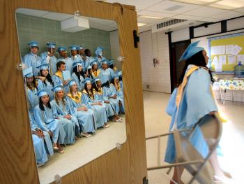 Members of the 2008 graduating class of South Plaquemines High School wait for the start of their commencement May 21, 2008 in Boothville, La. South Plaquemines High School was formed in the aftermath of Hurricane Katrina by merging three destroyed high schools. (Mario Tama/Getty Images)