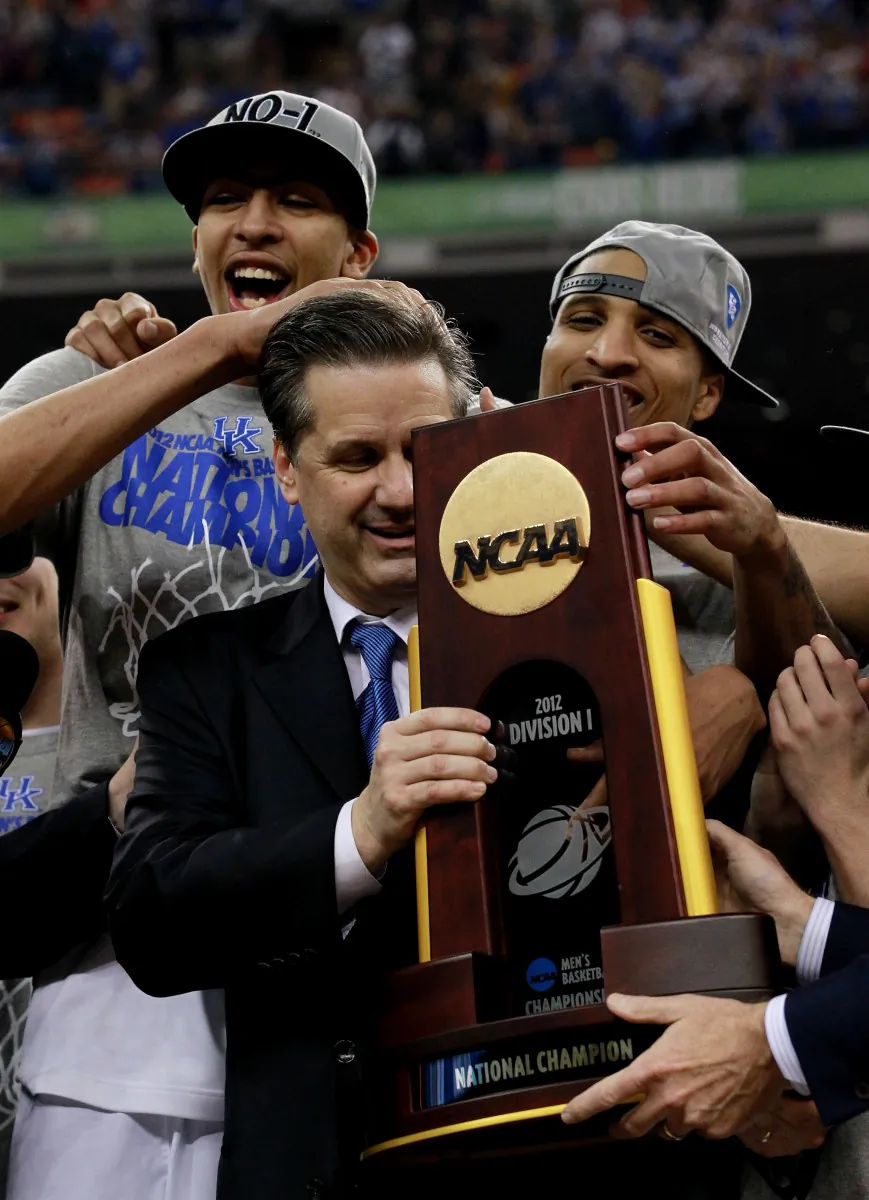 Kentucky head coach John Calipari (C) won his first National Championship Monday night at the Final Four. (Ronald Martinez/Getty Images)