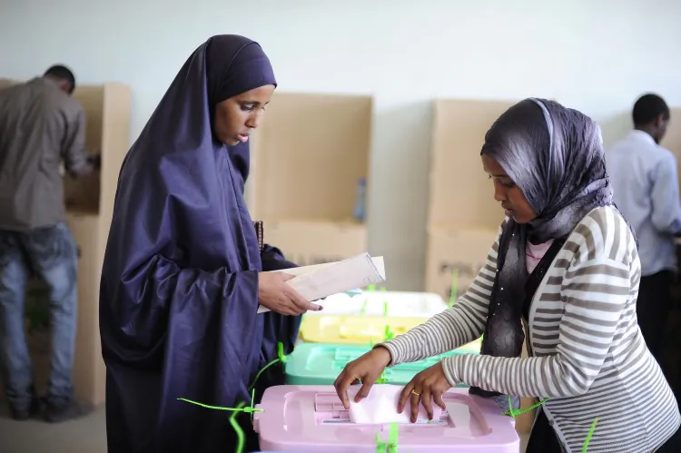 An armed security officer guards on March 5, 2013 election results in ballot boxes that have been tallied at a tallying centre in Kakamega, western Kenya, a day after the country held national elections. (Tony Karumba/AFP/Getty Images)