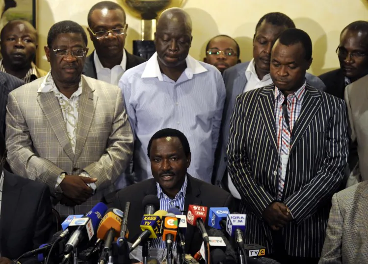 Kalonzo Musyoka (bottom), Kenya's outgoing vice president and running mate of CORD alliance's presidential candidate Prime Minister Raila Odinga, gives a press conference flanked by other alliance members on March 7, 2013, in the Kenyan capital, Nairobi. He alleges that vote results have been "doctored" and demands a halt to vote counting, stressing, however that his accusations are "not a call to mass action." (Tony Karumba/AFP/Getty Images)
