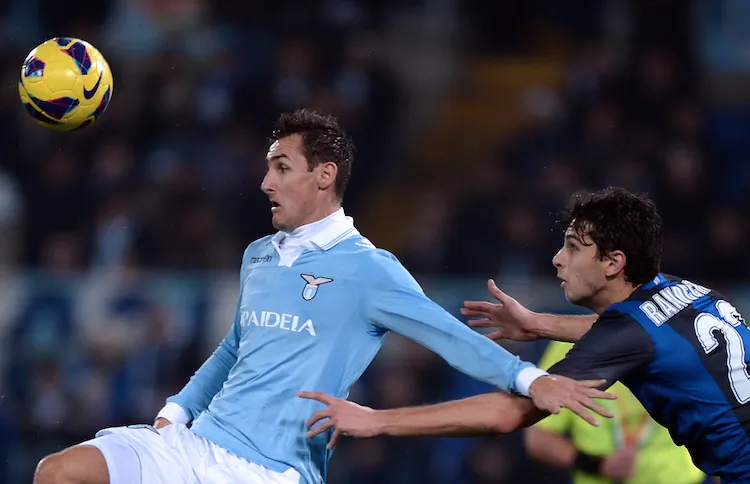 Lazio’s Miroslav Klose fends off Inter Milan’s Andrea Ranocchia in Serie A action on Sat. Dec. 15 in Rome. (Filippo Monteforte/AFP/Getty Images)