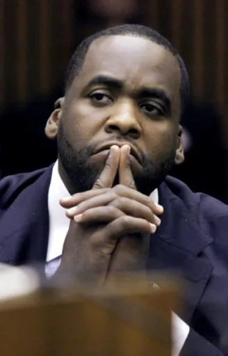 Detroit contractor Bobby Ferguson (4th R) arrives at U.S. District Court to hear the jury's verdict in his public corruption trial Mar. 11 in Detroit, Mich. Ferguson and former Detroit Mayor Kwame Kilpatrick were convicted on federal racketeering charges. (Bill Pugliano/Getty Images)
