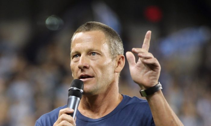 Lance Armstrong addresses the crowd prior to the first soccer game at Livestrong Sporting Park in Kansas City on June 9, 2011. Armstrong stepped down as chairman of his Livestrong cancer-fighting charity on Wednesday and sponsors Nike and Anheuser-Busch cut ties with the cyclist after the U.S. Anti-Doping Agency released details of Armstrong’s long-time involvement in doping last week. (Jamie Squire/Getty Images)