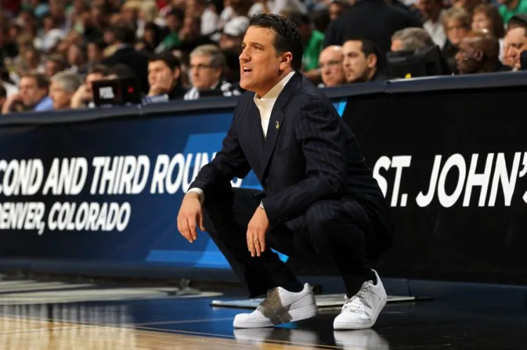 St. John's head basketball coach Steve Lavin raises cancer awareness with his sneakers and tie-less look. (Doug Pensinger/Getty Images)