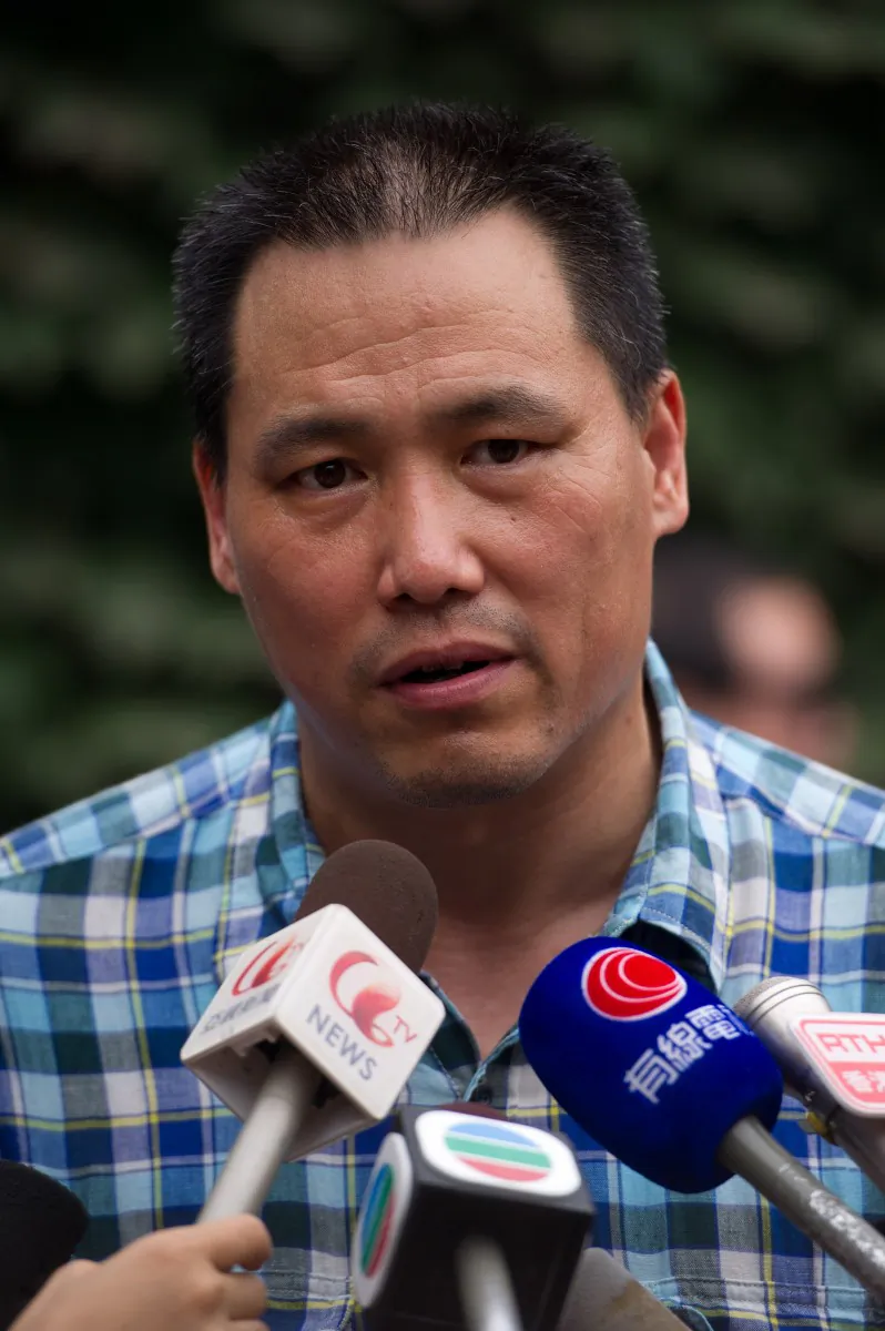 Lawyer for Chinese artist Ai Weiwei, Pu Zhiqiang, speaks to the media at Ai's compound in Beijing on July 20, 2012. Pu Zhiqiang recently criticized the former Party security czar Zhou Yongkang. (Ed Jones/AFP/Getty Images)