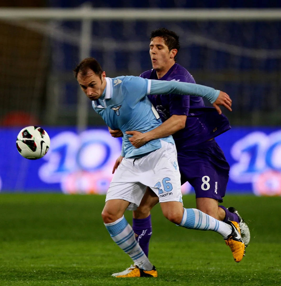 Fiorentina goal scorer Stevan Jovetic holds back Lazio’s Stefan Radu in Serie A action at Stadio Olimpico in Rome on Mar. 10. (Paolo Bruno/Getty Images)