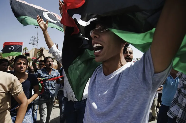 Libyans celebrate in Martyrs' Square in Tripoli after voting for the Libyan General National Assembly on July 7. Eager voters cast ballots in Libya's first free national elections for decades after the ouster of dictator Moammar Gadhafi. (Gianluigi Guercia/AFP/GettyImages)