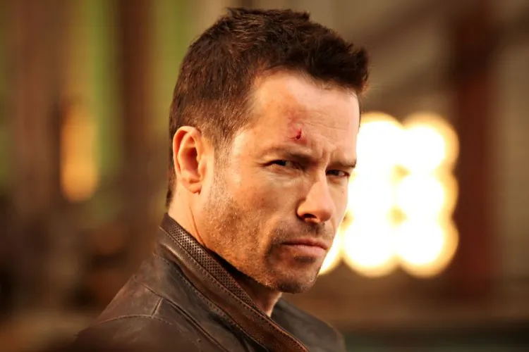 Maggie Grace and Guy Pearce in the science fiction action-thriller 'Lockout,' a film about a wrongly convicted man who is offered freedom if he can save the president’s daughter from an outer-space prison. (Open Road Films)