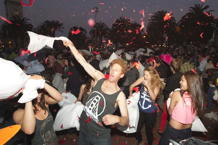 People participate in a massive pillow fight at Justin Herman Plaza in San Francisco, Calif., on Feb. 14, 2013. (Alex Ma/The Epoch Times)