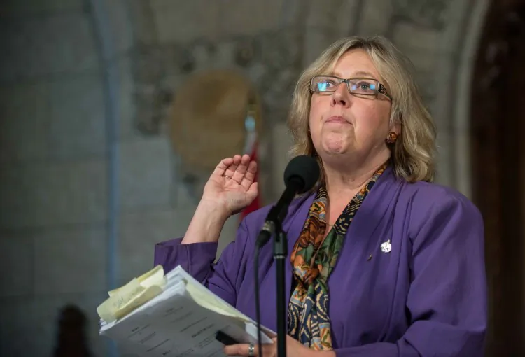 Green MP Elizabeth May denounces changes to the Navigable Waters Protection Act to reporters in the foyer of the House of Commons in Ottawa on Oct., 18, 2012. May says the government is effectively gutting the Act, a concern echoed by NDP MPs. (Matthew Little/The Epoch Times)