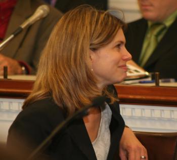 COMPENSATING THE POOR: Martha Coven, from the Center for Budget Policy and Priorities, described the impact of rising prices in fuel and food on lower income families due to taxing carbon products. She spoke at a Congressional hearing Nov. 13. (Gary Feuerberg/Epoch Times) COMPENSATING THE POOR: Martha Coven, from the Center for Budget Policy and Priorities, described the impact of rising prices in fuel and food on lower income families due to taxing carbon products. She spoke at a Congressional hearing Nov. 13. (Gary Feuerberg/Epoch Times)