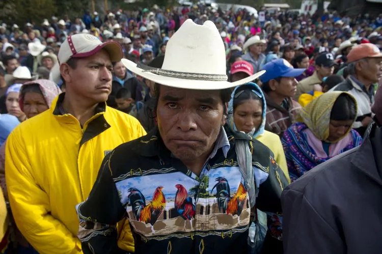 Raramuris indigenous people gather to receive humanitarian aid from the Mexican Red Cross in Mexico on Jan 21. With natural disasters causing devastating financial tolls around the world, Mexico is investing hundreds of millions in preventive measures against them. (Yuri Cortez/AFP/Getty Images)
