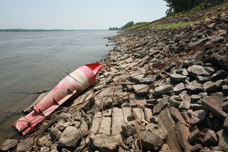 A buoy used to help guide barges rests on the bank after the water level dropped on the Mississippi River near Wyatt, Mo., this year. Some barge operators have lightened their loads or stopped running altogether because of low water levels. (Scott Olson/Getty Images)
