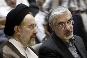 Iranian opposition leader, Mir Hossein Mousavi (R) and his close ally, former reformist president, Mohammad Khatami (L) at memorial service in Tehran on July 31. On Tuesday Mousavi was fired from his position as president of the Iranian Academy of the Arts, a position he held for 11 years. (Ali Mohammadi/AFP/Getty Images)