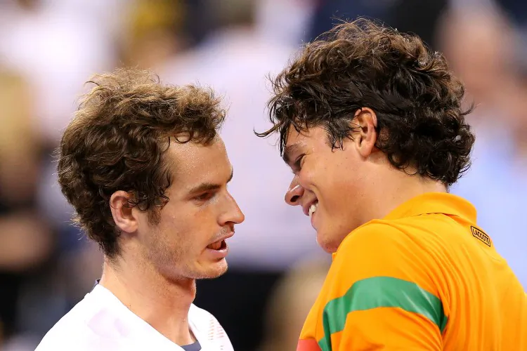Milos Raonic (R) has words of praise for Andy Murray after their fourth round match at the US Open on Monday. (Cameron Spencer/Getty Images)