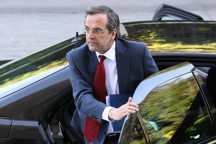 Antonis Samaras, leader of the New Democracy party, arrives at the Parliament building to meet with the leader of Syriza, Alexis Tsipras, to attempt to form a coalition government on June 18. The conservative, pro-bailout New Democracy party came in first winning 130 of the 300 seats in Parliament. (Oli Scarff/Getty Images)