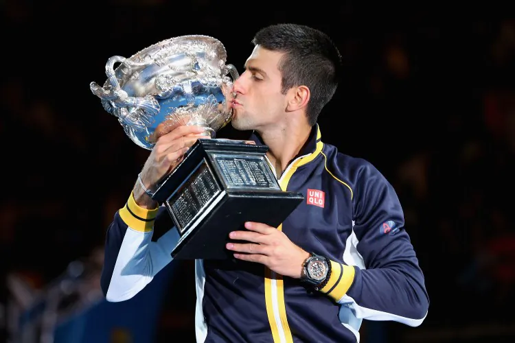 Novak Djokovic became the first man in the open era to win three straight Australian Open titles. (Julian Finney/Getty Images)