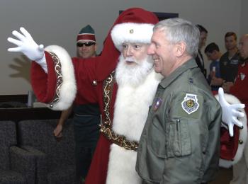Santa Claus visits NORAD Headquarters in Colorado Springs, Colorado, Dec. 23, 2008, for a pre-flight briefing before his annual Christmas Eve flight. Over 1,200 volunteers helped with the NORAD Tracks Santa operation in 2008 to answer thousands of phone calls and e-mails from children around the world eagerly awaiting Santa's visit. (NORAD and USNORTHCOM Public Affairs) Santa Claus visits NORAD Headquarters in Colorado Springs, Colorado, Dec. 23, 2008, for a pre-flight briefing before his annual Christmas Eve flight. Over 1,200 volunteers helped with the NORAD Tracks Santa operation in 2008 to answer thousands of phone calls and e-mails from children around the world eagerly awaiting Santa's visit. (NORAD and USNORTHCOM Public Affairs)