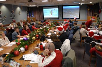 Military and civilian volunteers answer phone calls and emails from children wanting to know Santa's whereabouts on Christmas Eve, 2007, at the NORAD Tracks Santa Operations Center at Peterson Air Force Base in Colorado. NORAD Tracks Santa celebrated its 50th year in 2008. (NORAD and USNORTHCOM Public Affairs) Military and civilian volunteers answer phone calls and emails from children wanting to know Santa's whereabouts on Christmas Eve, 2007, at the NORAD Tracks Santa Operations Center at Peterson Air Force Base in Colorado. NORAD Tracks Santa celebrated its 50th year in 2008. (NORAD and USNORTHCOM Public Affairs)