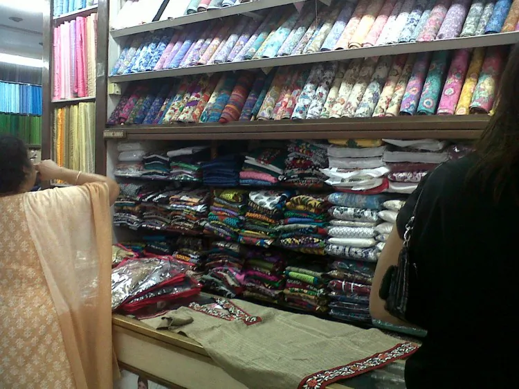 A fashion store in Bombay, where colorful fabrics are made into custom garments.(By Michele Goncalves )