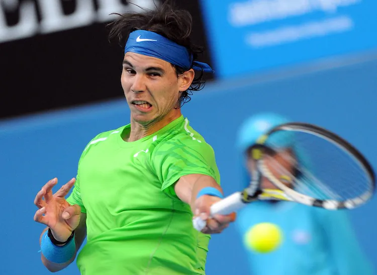 Rafael Nadal takes a swing during his round one match of The Australian Open. (Torsten Blackwood/AFP)