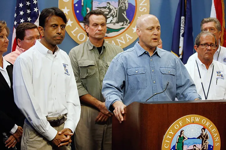 Mayor of New Orleans Mitch Landrieu (3rd R) speaks to the media as Lousiana Gov. Bobby Jindal (3rd L) listens during a press conference on Hurricane Isaac at the New Orleans City Hall, Aug. 27 in New Orleans. Tropical Storm Isaac is expected to strengthen into at least a Category 1 hurricane before making landfall near New Orleans, La., early Wednesday. (Chris Graythen/Getty Images)