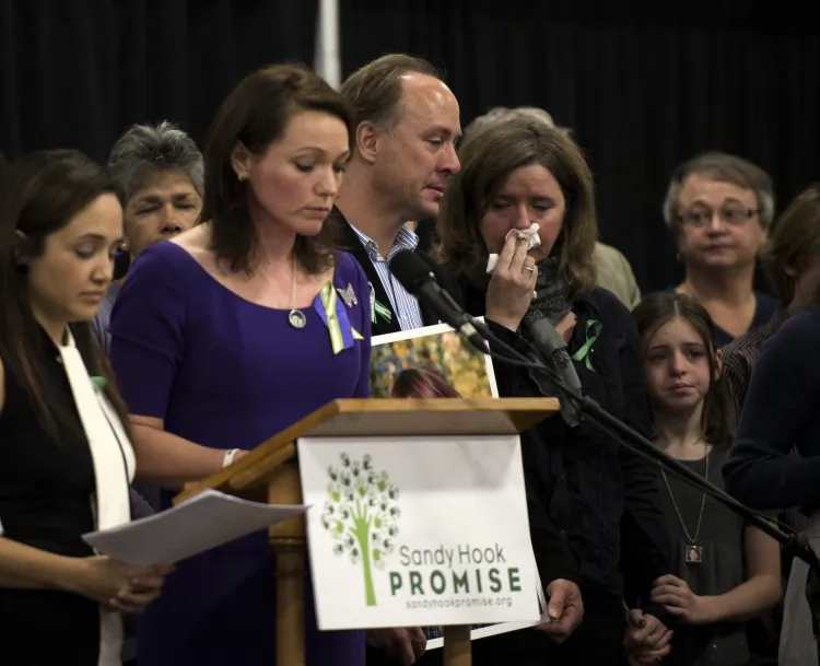 Family members of the victims of the Sandy Hook Elementary School shooting attend a news conference Monday, Jan. 14, 2013, in Newtown, Conn. Parents of victims called for national conversation on ways to reduce gun violence. (Don Emmert/AFP/Getty Images)