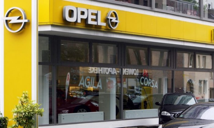 The Opel logo can be seen at an Opel dealership in the western German city of Bochum in this file photo. Opel is in negotiations to close a core plant in Bochum due to sales dropping 18.9 percent compared to last year. (Patrik Stollarz/AFP/Getty Images)