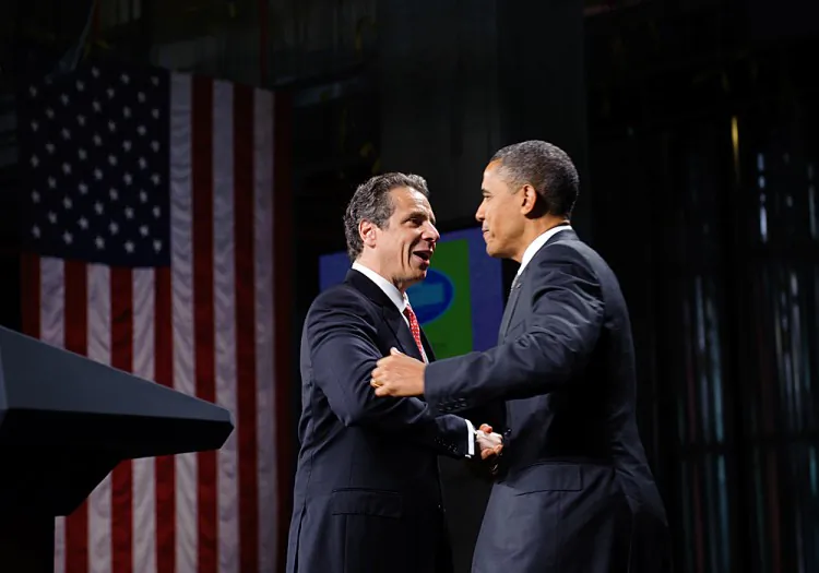 President Barack Obama (R) embraces New York Governor Andrew Cuomo (L) after introducing him in a speech on Tuesday at the State University of New York Albany.(MANDEL NGAN/AFP/GettyImages)