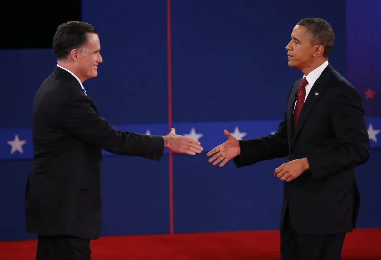 Republican presidential candidate Mitt Romney (L) and President Barack Obama shake hands Oct. 16 after last week's debate at Hofstra University in Hempstead, New York. Monday night's debate in Florida will be the third and final presidential debate. (John Moore/Getty Images)